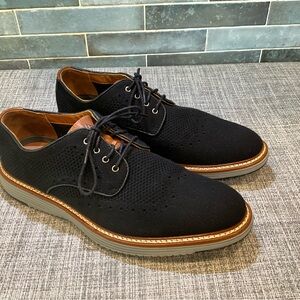 Johnston & Murphy Men's Upton Knit Wingtip shoes in black knit.